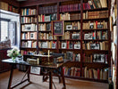 Inherited family library with shelves of books collected over generations
