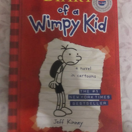 Diary of a Wimpy Kid, a Novel in Cartoons